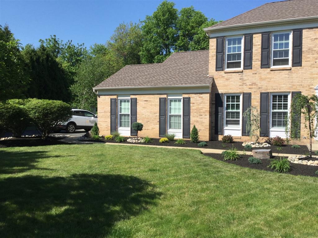 A freshly cut lawn outside a house