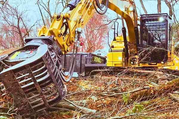A demolition digger and dumpster